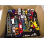 Box containing various small die-cast toy vehicles