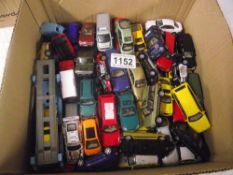 Box containing various small die-cast toy vehicles