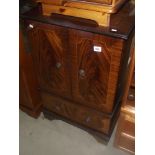 A darkwood inlaid veneered TV cabinet