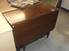 A rectangular drop leaf table