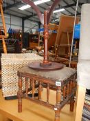 A piano stool and a tripod table.