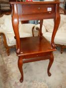 A pair of mahogany side tables.