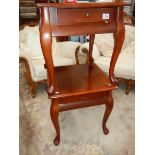 A pair of mahogany side tables.