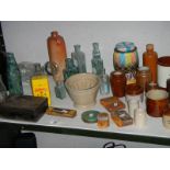 A mixed lot of old bottles, stoneware pots etc.