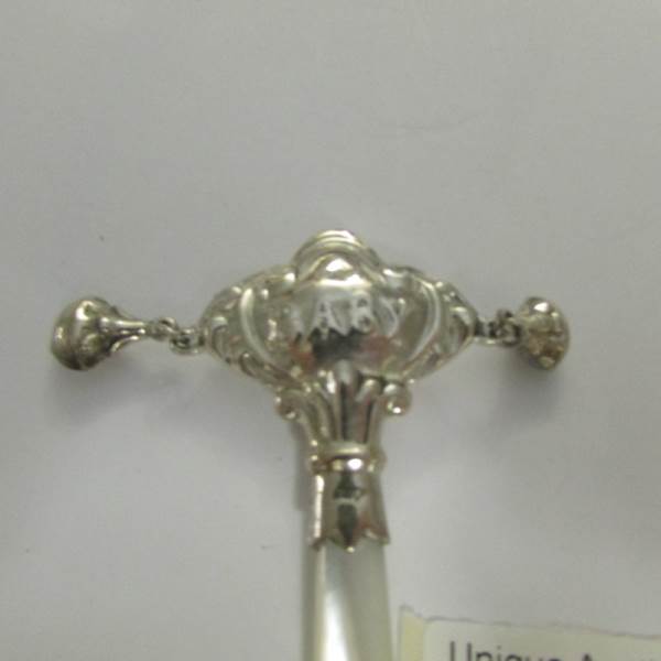 A silver rattle with mother of pearl handle. - Image 2 of 3