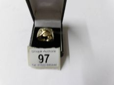 A gent's gold puzzle ring, size R, approximately 12 grams.