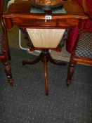 A Victorian mahogany sewing table.