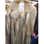 A fur coat. (in good condition).