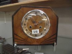 An Art Deco mantel clock with key, in working order.