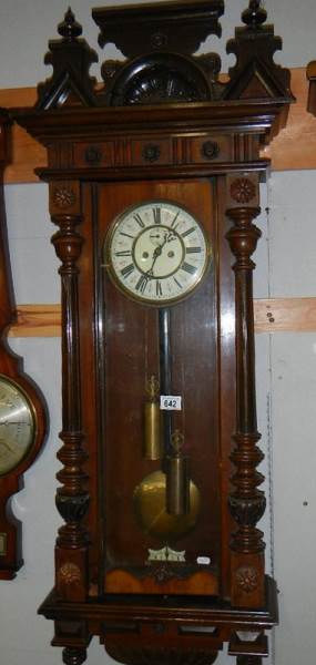 A double regulator wall clock.