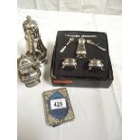 A boxed silver plate cruet set, sugar sifter etc.