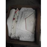 A box of mixed linen/fabric including crocheted doilies etc.