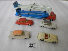 A Corgi 1101 Bedford Carrimore transporter and 4 cars.