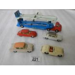 A Corgi 1101 Bedford Carrimore transporter and 4 cars.