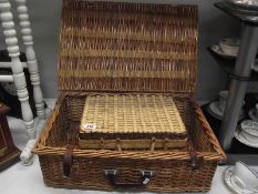 2 wicker picnic baskets.