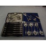 A cased set of 6 silver handled knives,