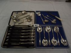 A cased set of 6 silver handled knives,