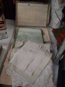 A quantity of vintage and Edwardian linen tablecloths, tray cloths etc.