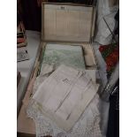 A quantity of vintage and Edwardian linen tablecloths, tray cloths etc.