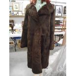 A coney fur coat, size unknown. (in good condition).