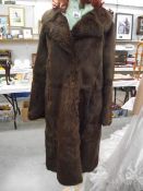 A coney fur coat, size unknown. (in good condition).