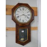 A rosewood drop dial wall clock.
