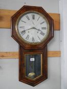 A rosewood drop dial wall clock.