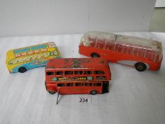 A Triang Minic clockwork bus (working) and 2 Mettoy friction coaches.