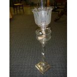 A silver plated Corinthian column oil lam o with cut glass font and acid etched shade.