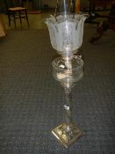 A silver plated Corinthian column oil lam o with cut glass font and acid etched shade.