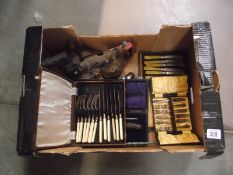 A mixed lot of cased cutlery, brass blow lamps etc.