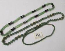 3 necklaces (possibly jade).