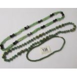 3 necklaces (possibly jade).