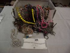 A box of unsorted costume jewellery etc.