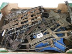 A box containing a quantity of two rail O gauge track including various junction points.