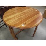 A solid pine gate leg kitchen table.