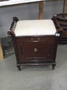 An Edwardian piano stool with music rack