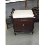 An Edwardian piano stool with music rack