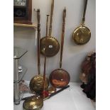 6 brass and copper bed warming pans and a copper post horn.