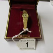 A boxed Seiko make ladies wrist watch in yellow metal.