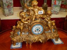 A good French spelter mantle clock with porcelain panels. In good working order.