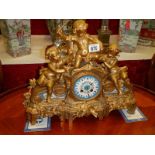 A good French spelter mantle clock with porcelain panels. In good working order.