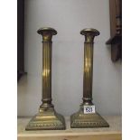 A pair of brass reeded column candle sticks ****Condition report**** Made by 'WMF'