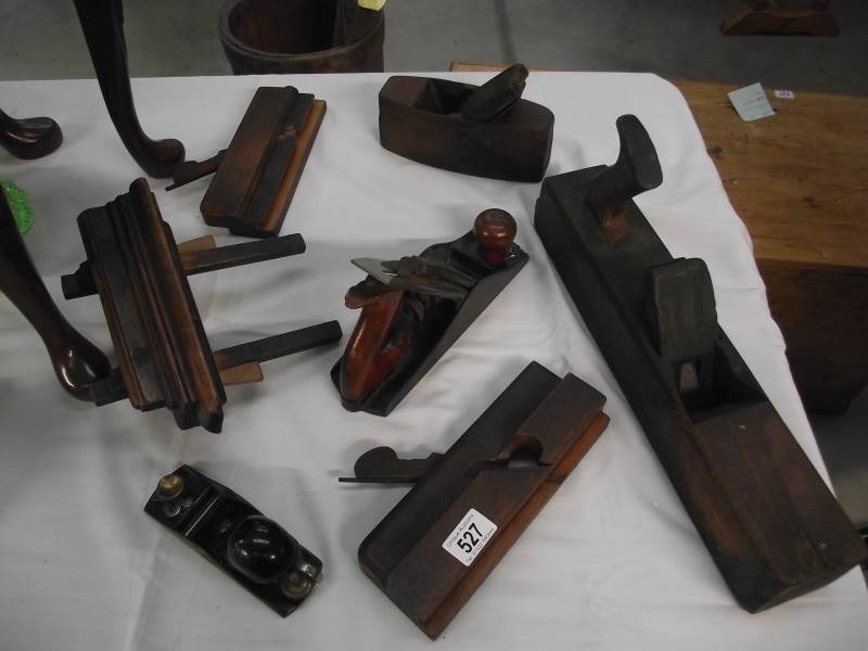 A quantity of vintage wood working planes.