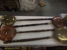 4 Victorian copper and brass bed warming pans.