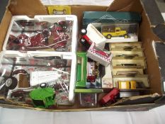 A quantity of boxed diecast Including Lledo, Burago, Corgi etc.