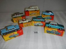 7 boxed Dinky cars, 2 over painted, others in reasonable condition, all with original boxes,