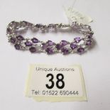 An amethyst bracelet - 39 amethysts set in silver.