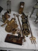 A mixed lot of brass ware including shell cases, toasting forks, horse etc.