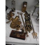 A mixed lot of brass ware including shell cases, toasting forks, horse etc.